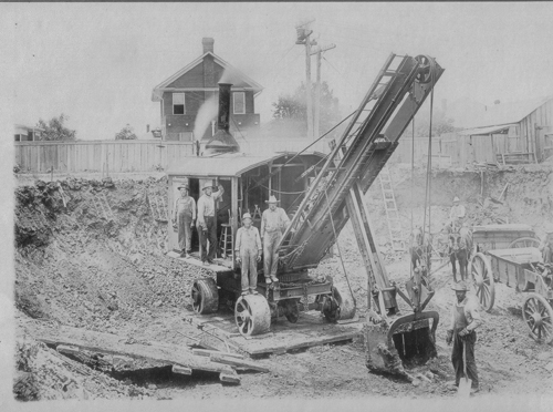 Picute of Vilbig Brother's Excavation - Steam Shovel - Vilbig Brother's Excavation construction workers pictured on unknown building site with a steam shove and wagon. Circa 1910-1915